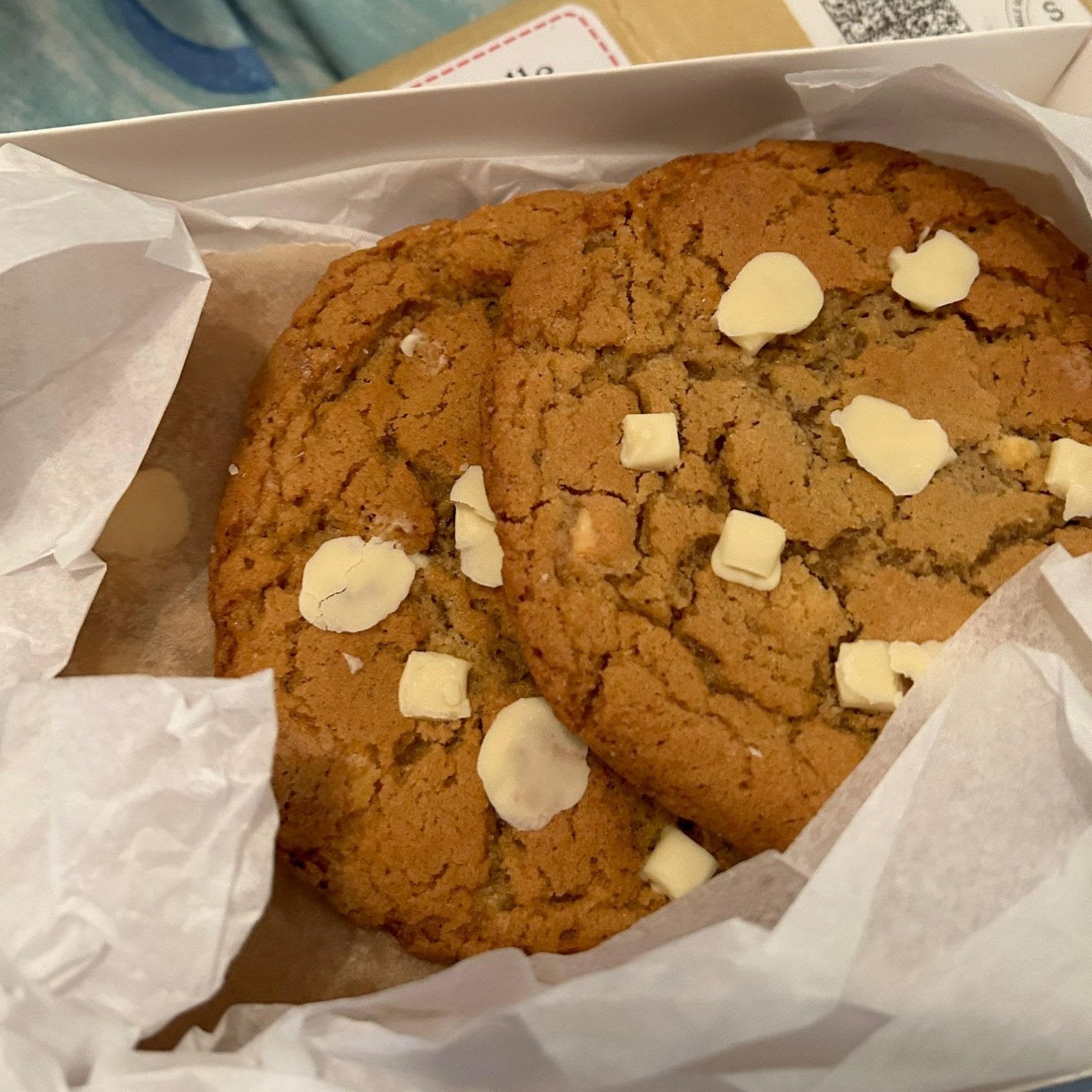Showing cookies with white chocolate in a box for the postal orders.